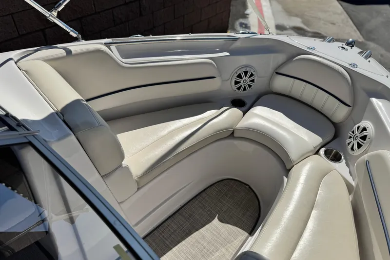 Slide: The Image of Luxurious interior of 2010 Four Winns H210 boat with plush seating and cup holders. - 12