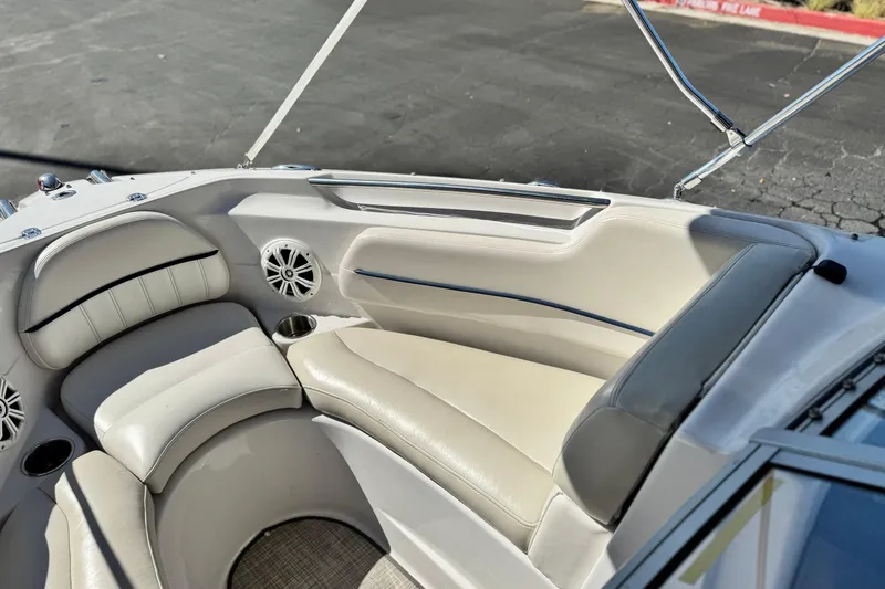 Slide: The Image of Interior of 2010 Four Winns H210 boat with beige seating and cup holders. - 13