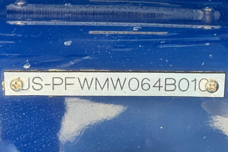 Slide: The Image of Hull identification number on a 2010 Four Winns H210 boat. - 24