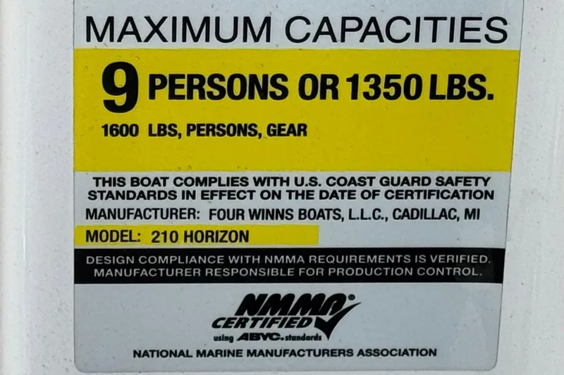 Slide: The Image of 2010 Four Winns H210 capacity label: 9 persons or 1350 lbs, NMMA certified. - 25
