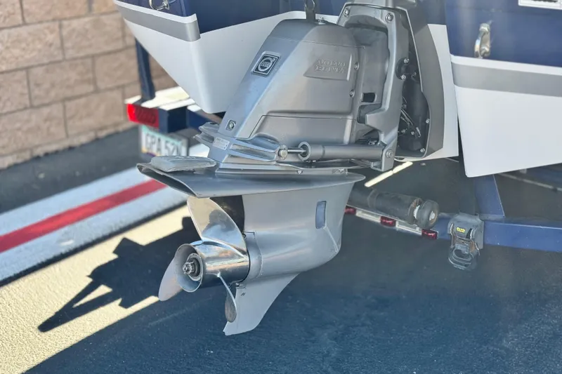 Slide: The Image of 2010 Four Winns H210 boat with Volvo Penta outdrive, parked on a trailer. - 7