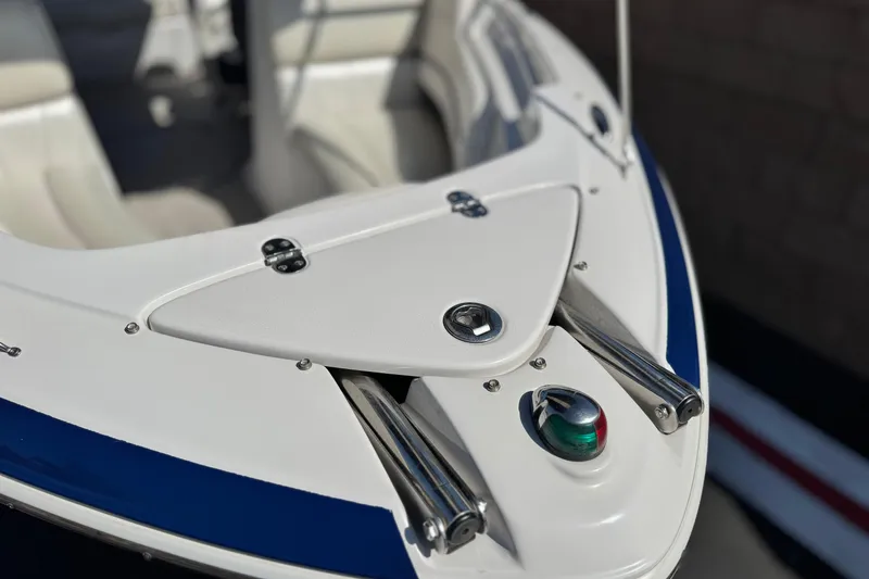 Slide: The Image of Bow of 2010 Four Winns H210 boat with navigation light and cleats. - 8