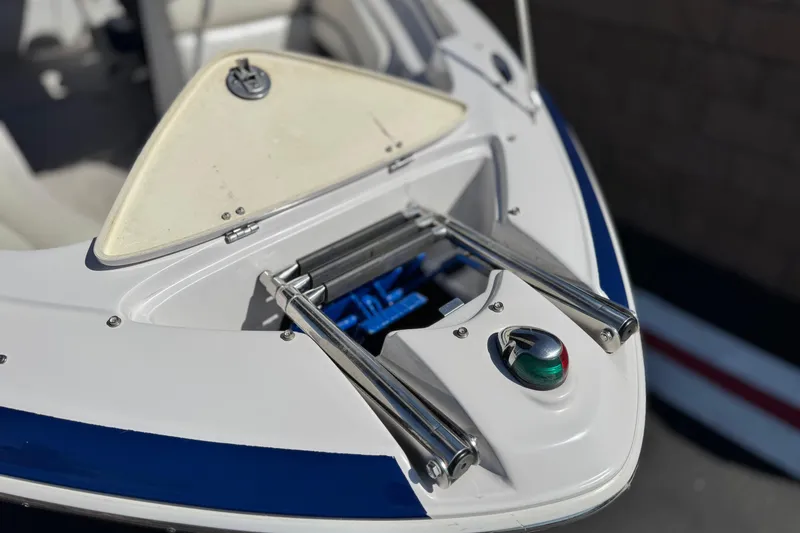 Slide: The Image of 2010 Four Winns H210 boat bow with ladder and navigation light. - 9