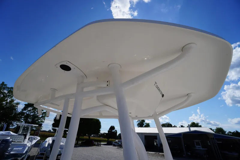 Slide: The Image of 2016 Tidewater 220 LXF boat's T-top against a clear blue sky. - 12