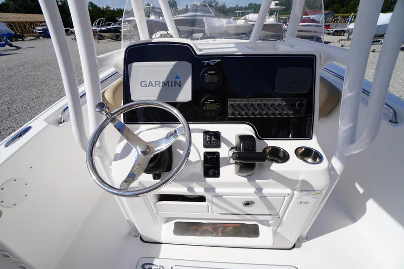 Slide: The Image of 2016 Tidewater 220 LXF boat console with Garmin navigation system and steering wheel. - 17