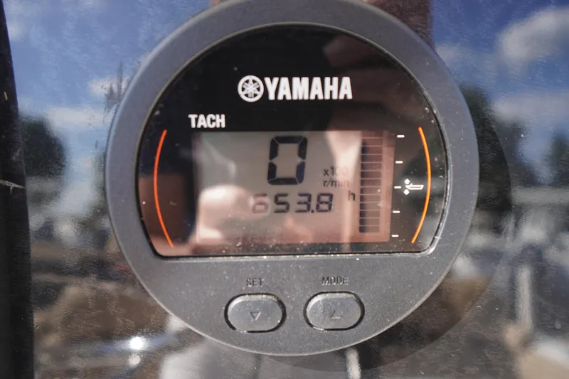 Slide: The Image of Yamaha tachometer displaying 653.8 hours on a 2016 Tidewater 220 LXF boat. - 19