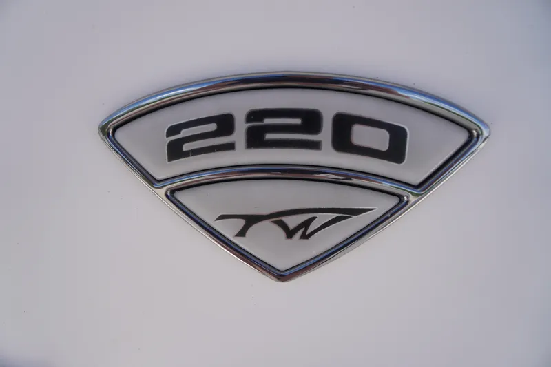 Slide: The Image of Emblem of 2016 Tidewater 220 LXF boat, featuring model number and logo. - 2