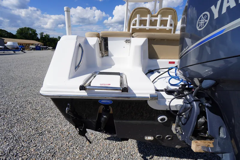 Slide: The Image of 2016 Tidewater 220 LXF boat with Yamaha engine, parked on gravel under a blue sky. - 34