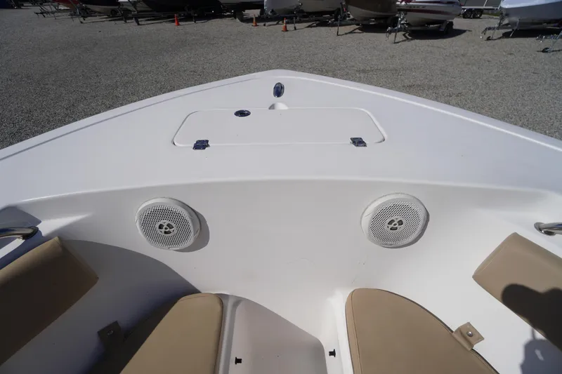 Slide: The Image of 2016 Tidewater 220 LXF boat interior with speakers and seating. - 4