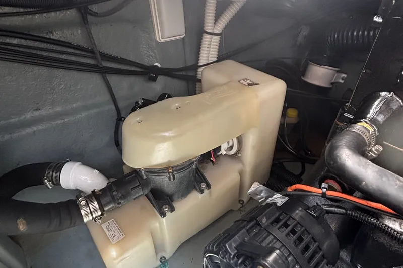 Slide: The Image of Engine compartment of a 2003 Sea Ray 280 Sundancer boat, showing mechanical components. - 31