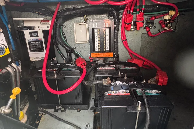 Slide: The Image of Electrical system of a 2003 Sea Ray 280 Sundancer with batteries and wiring. - 32