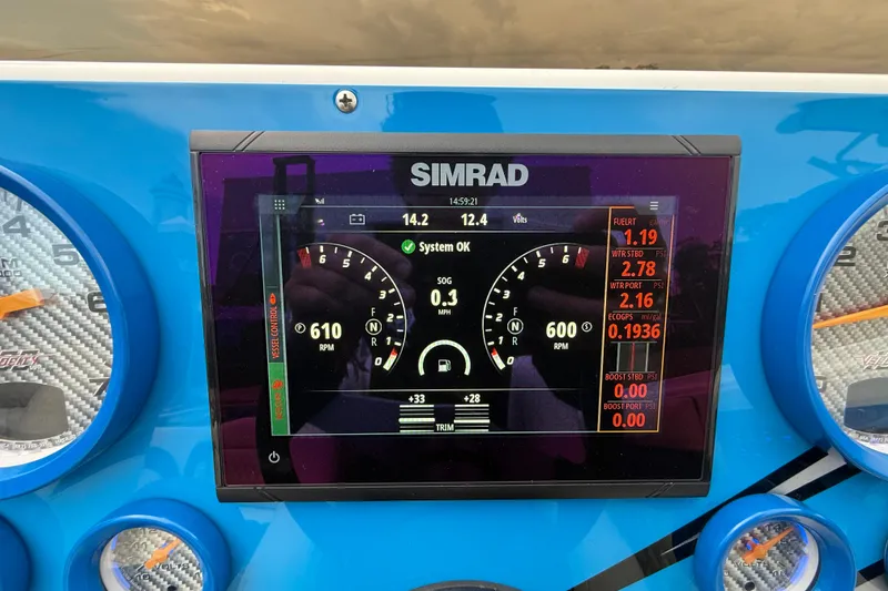 Slide: The Image of Simrad display on 2021 Velocity 290sc boat dashboard showing RPM and system status. - 22