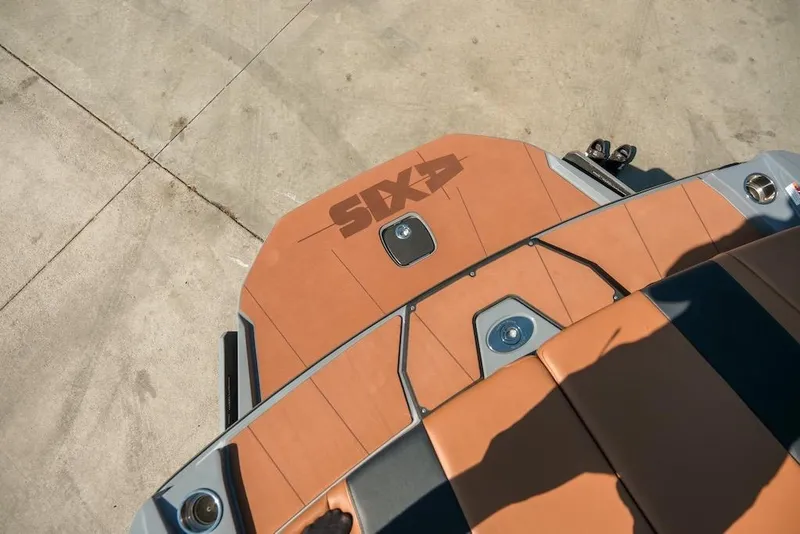 Slide: The Image of 2024 Axis T220 boat deck with tan upholstery and sleek design. - 16