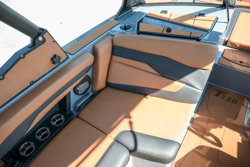 Slide: The Image of 2024 Axis T220 boat interior with tan and gray seating, showcasing modern design and comfort. - 18