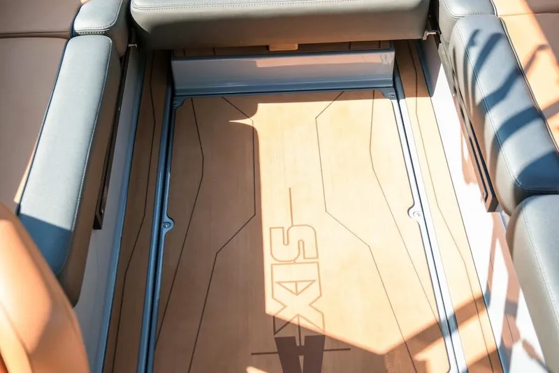Slide: The Image of 2024 Axis T220 boat interior with sleek seating and stylish flooring design. - 21