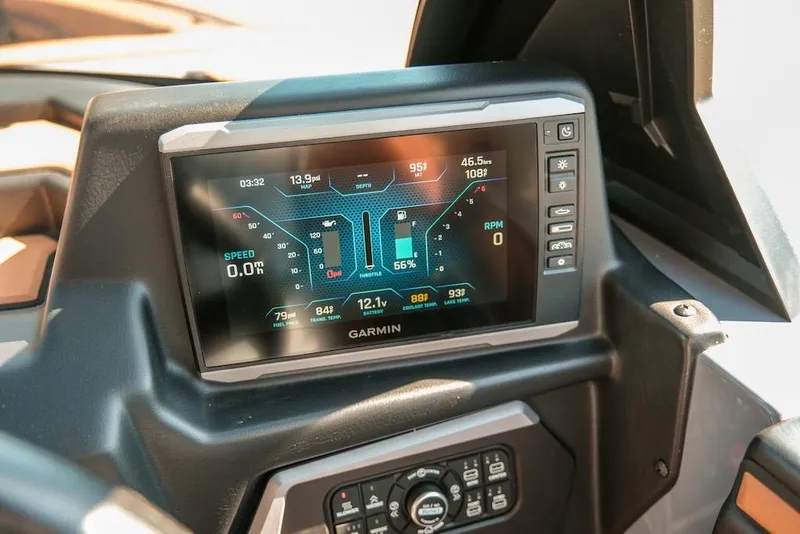 Slide: The Image of 2024 Axis T220 dashboard with Garmin display showing speed, RPM, and engine metrics. - 24