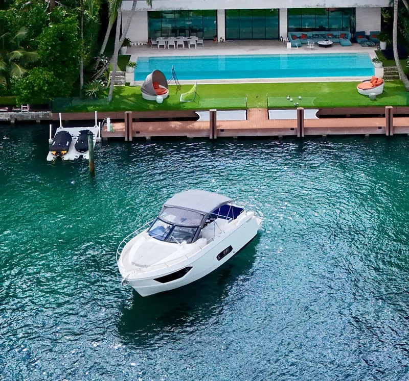 Slide: The Image of Luxury Absolute 40 yacht on turquoise water near modern waterfront villa, 2014 model. - 13
