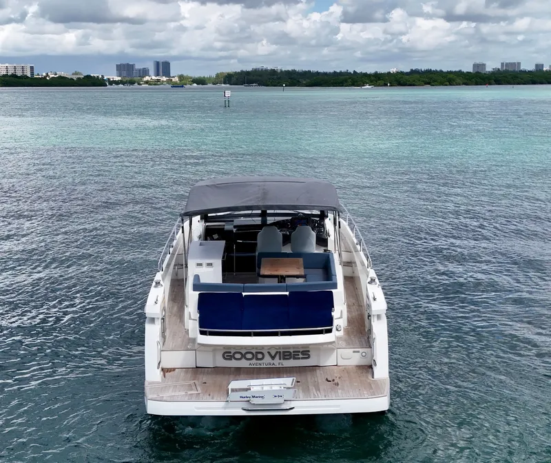 Slide: The Image of Luxury Absolute 40 yacht on serene waters, 2014 model, with "Good Vibes" text. - 17
