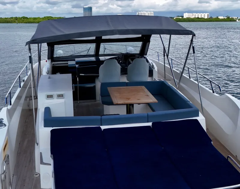 Slide: The Image of Luxury Absolute 40 yacht, 2014 model, featuring spacious deck and seating area on calm waters. - 30