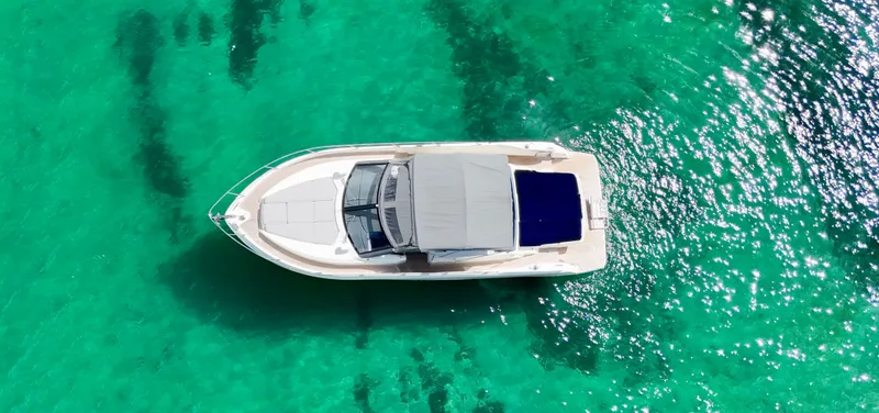 Slide: The Image of Aerial view of 2014 Absolute 40 yacht on clear turquoise water. - 32