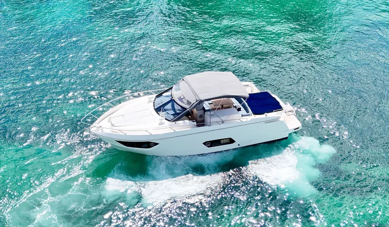 Slide: The Image of Luxurious 2014 Absolute 40 yacht cruising on clear turquoise waters. - 36