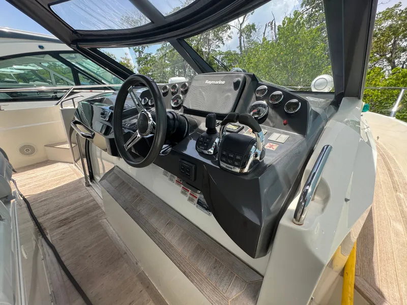 Slide: The Image of Cockpit of 2014 Absolute 40 yacht with steering wheel and control panel. - 45