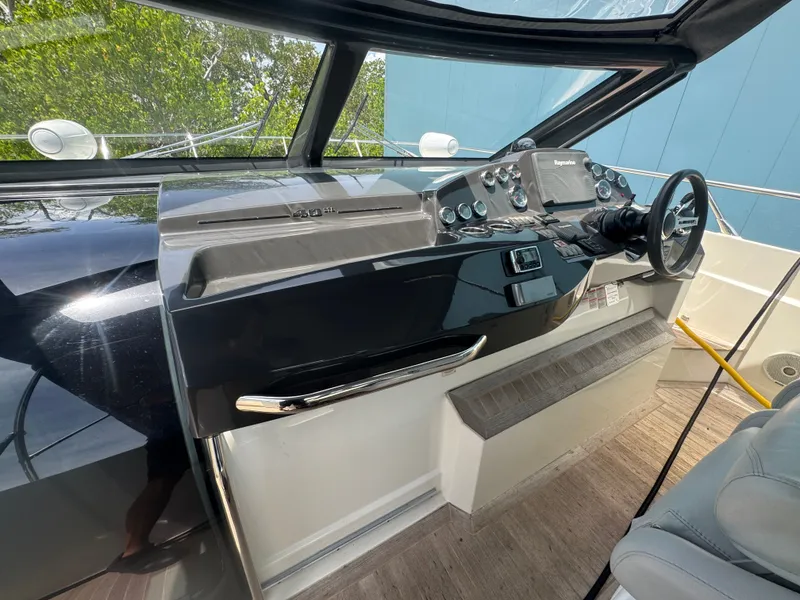 Slide: The Image of Helm of 2014 Absolute 40 yacht with modern controls and steering wheel. - 46