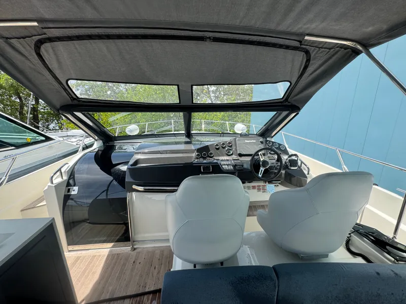 Slide: The Image of Interior view of 2014 Absolute 40 yacht cockpit with dual seats and modern controls. - 47