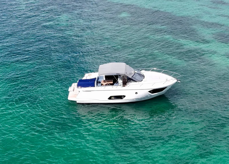 Slide: The Image of 2014 Absolute 40 yacht on clear turquoise water, aerial view. - 5