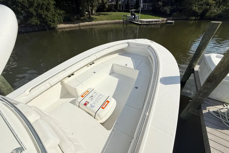 Slide: The Image of 2009 Regulator 34SS boat with dual engines on a calm lake. - 25