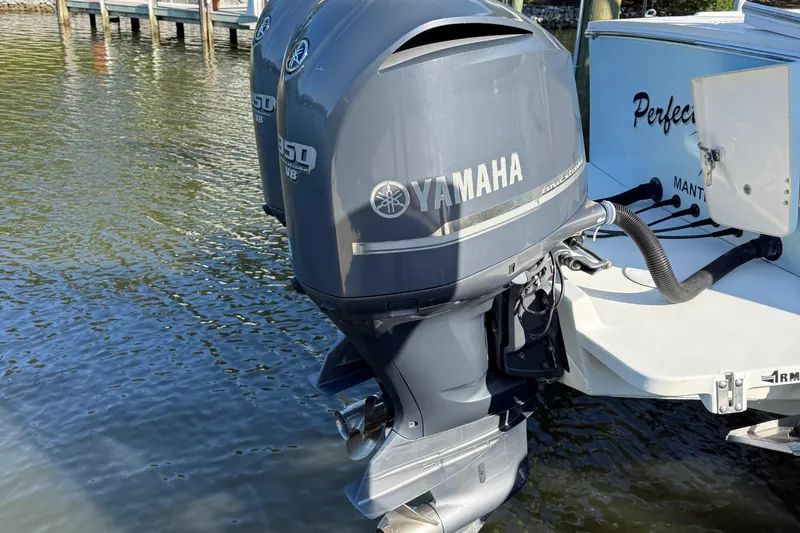 Slide: The Image of Open storage compartment on 2009 Regulator 34SS boat, near water. - 33