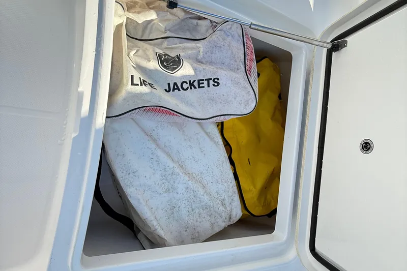 Slide: The Image of Twin Yamaha outboard engines on a 2009 Regulator 34SS boat at dock. - 36