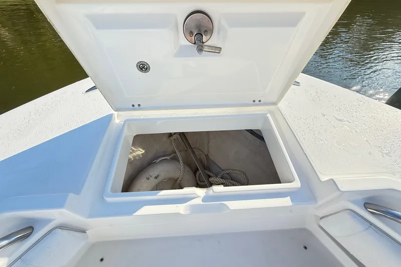 Slide: The Image of Storage compartment with life jackets on a 2009 Regulator 34SS boat. - 38