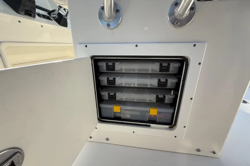 Slide: The Image of 2009 Regulator 34SS boat with open storage compartment and visible outboard motor. - 39