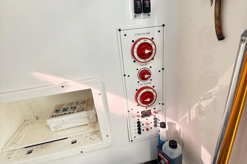 Slide: The Image of Open storage compartment on 2009 Regulator 34SS boat, showing ropes and equipment. - 40