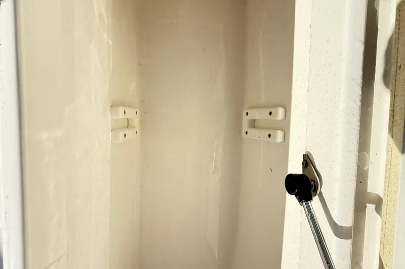 Slide: The Image of Storage compartment with tackle boxes on a 2009 Regulator 34SS boat. - 41