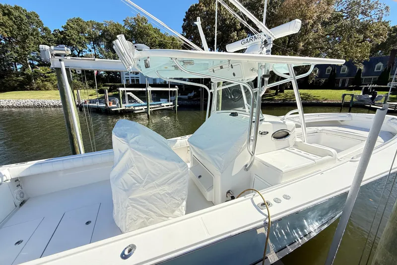 Slide: The Image of 2009 Regulator 34SS boat docked, featuring a sleek design and modern equipment. - 47