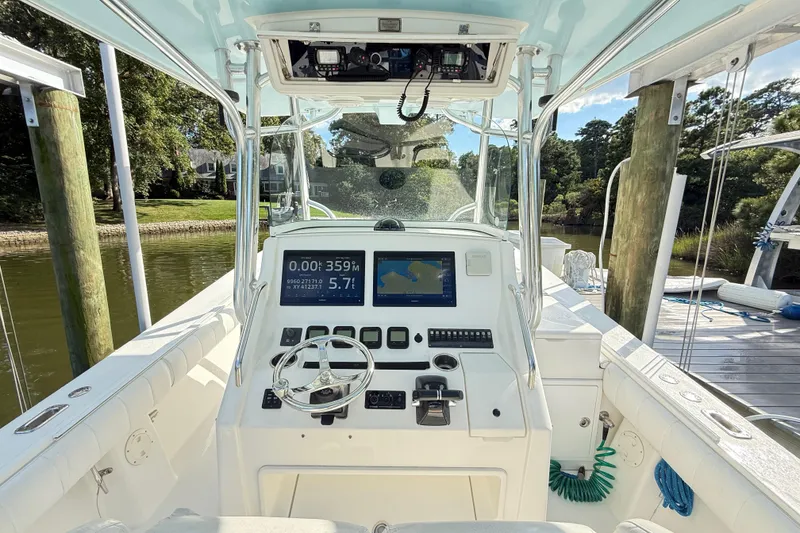 Slide: The Image of Aerial view of 2009 Regulator 34SS boat docked with dual engines. - 7