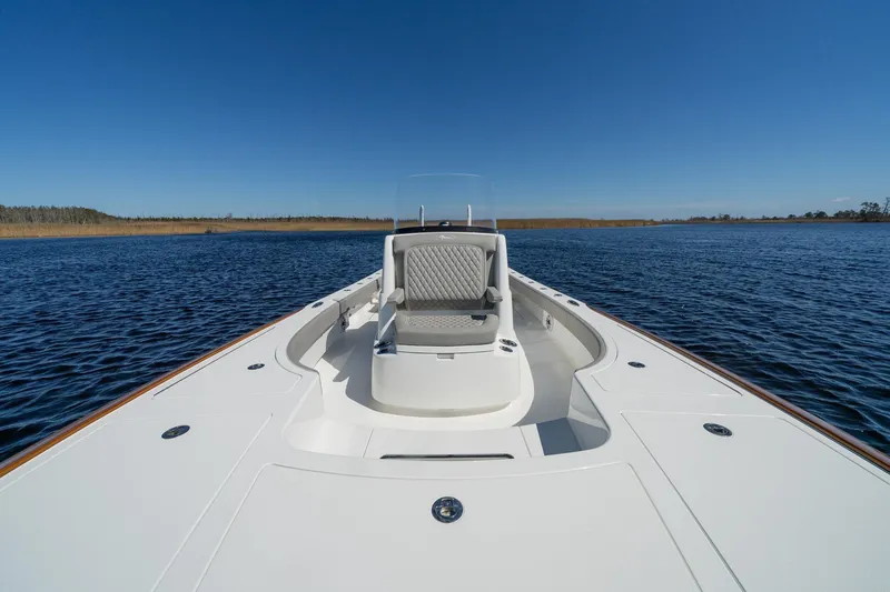 Slide: The Image of 2026 Valhalla Boatworks V-28 Bay on calm water under clear blue sky. - 11