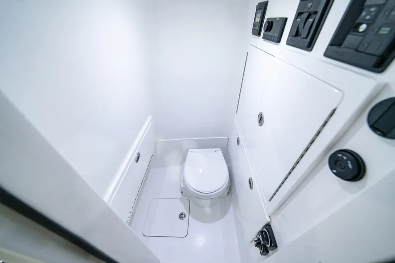 Slide: The Image of 2026 Valhalla Boatworks V-28 Bay interior bathroom with modern fixtures and controls. - 9