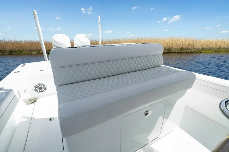 Slide: The Image of 2026 Valhalla Boatworks V-29 Hybrid with quilted seating, on a serene waterway. - 3