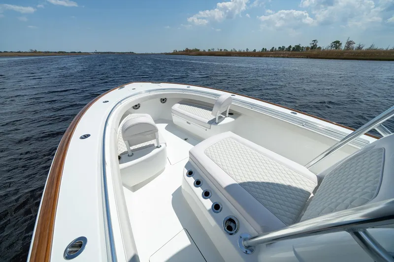Slide: The Image of 2026 Valhalla Boatworks V-29 Hybrid on calm water, featuring luxurious seating and sleek design. - 4