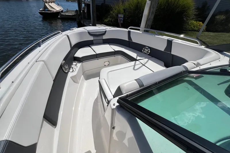 Slide: The Image of 2020 Chaparral 280 OSX boat interior with spacious seating and sleek design. - 2