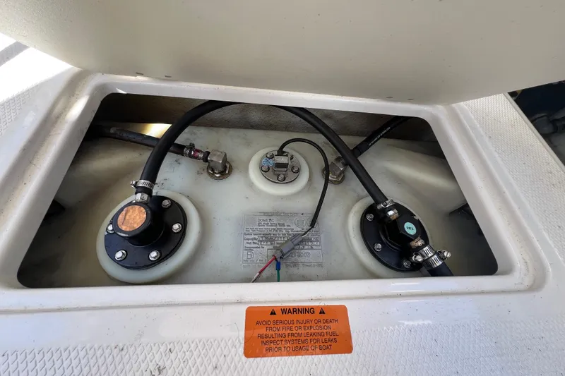 Slide: The Image of Fuel system components of a 2020 Chaparral 280 OSX boat with warning label. - 25