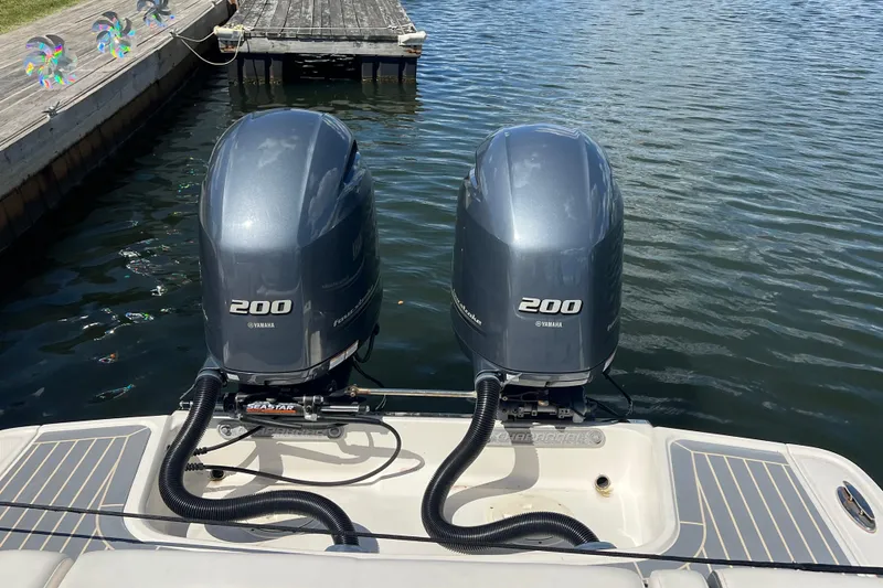 Slide: The Image of Twin Yamaha 200 engines on 2020 Chaparral 280 OSX boat at dockside. - 26