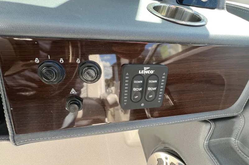 Slide: The Image of Control panel of 2020 Chaparral 280 OSX boat with Lenco trim tab switches. - 32