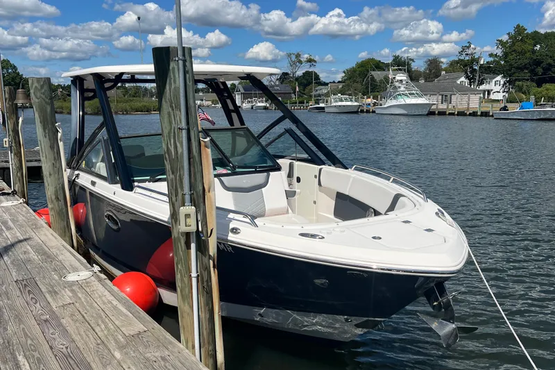 Slide: The Image of 2020 Chaparral 280 OSX boat docked on a sunny day with blue skies. - 7
