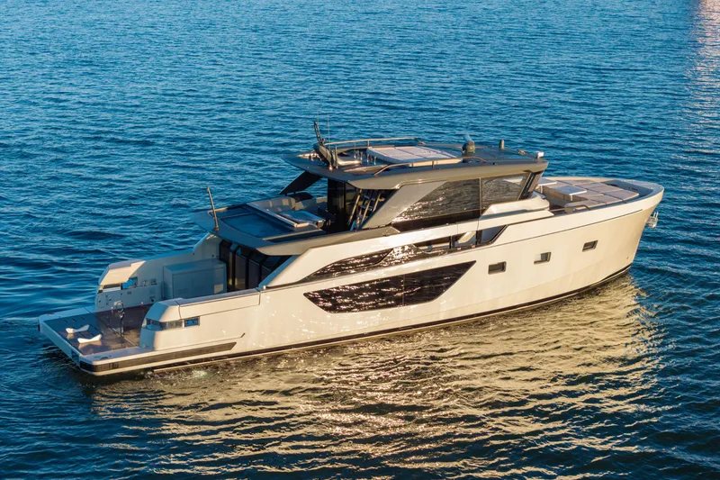 Slide: The Image of 2024 Bluegame BGX63 yacht cruising on open water, showcasing sleek design and luxury features. - 1