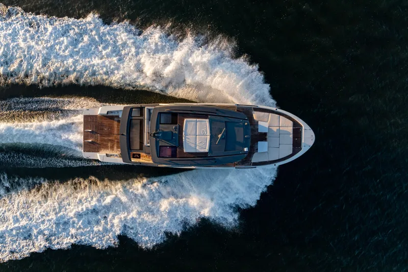 Slide: The Image of Aerial view of 2024 Bluegame BGX63 yacht cruising on open water. - 11