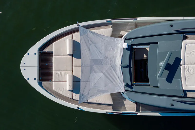 Slide: The Image of Top view of 2024 Bluegame BGX63 yacht with sunshade and seating area. - 22